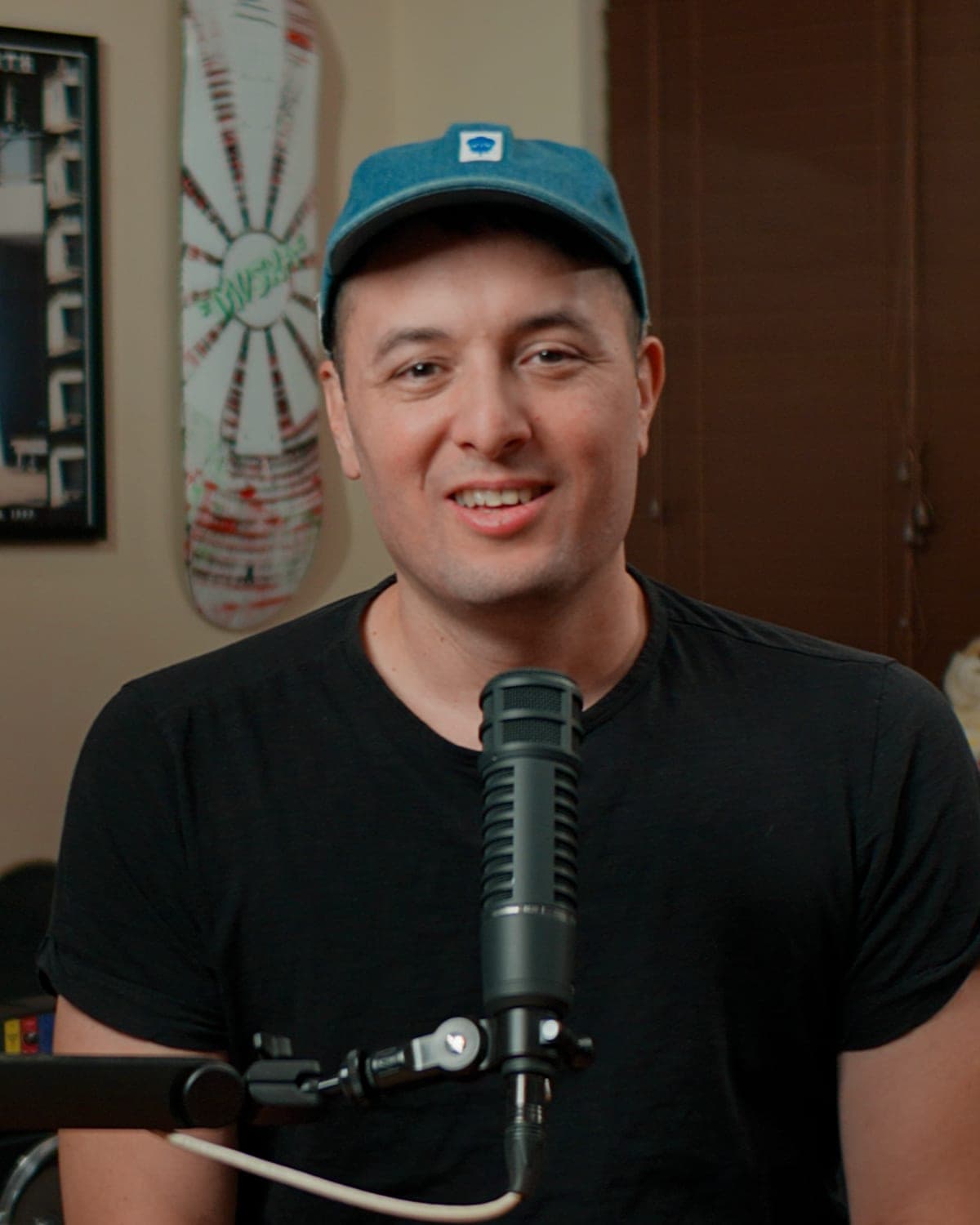 Adrian Robison, host of Prototype-v1, at the microphone in his studio